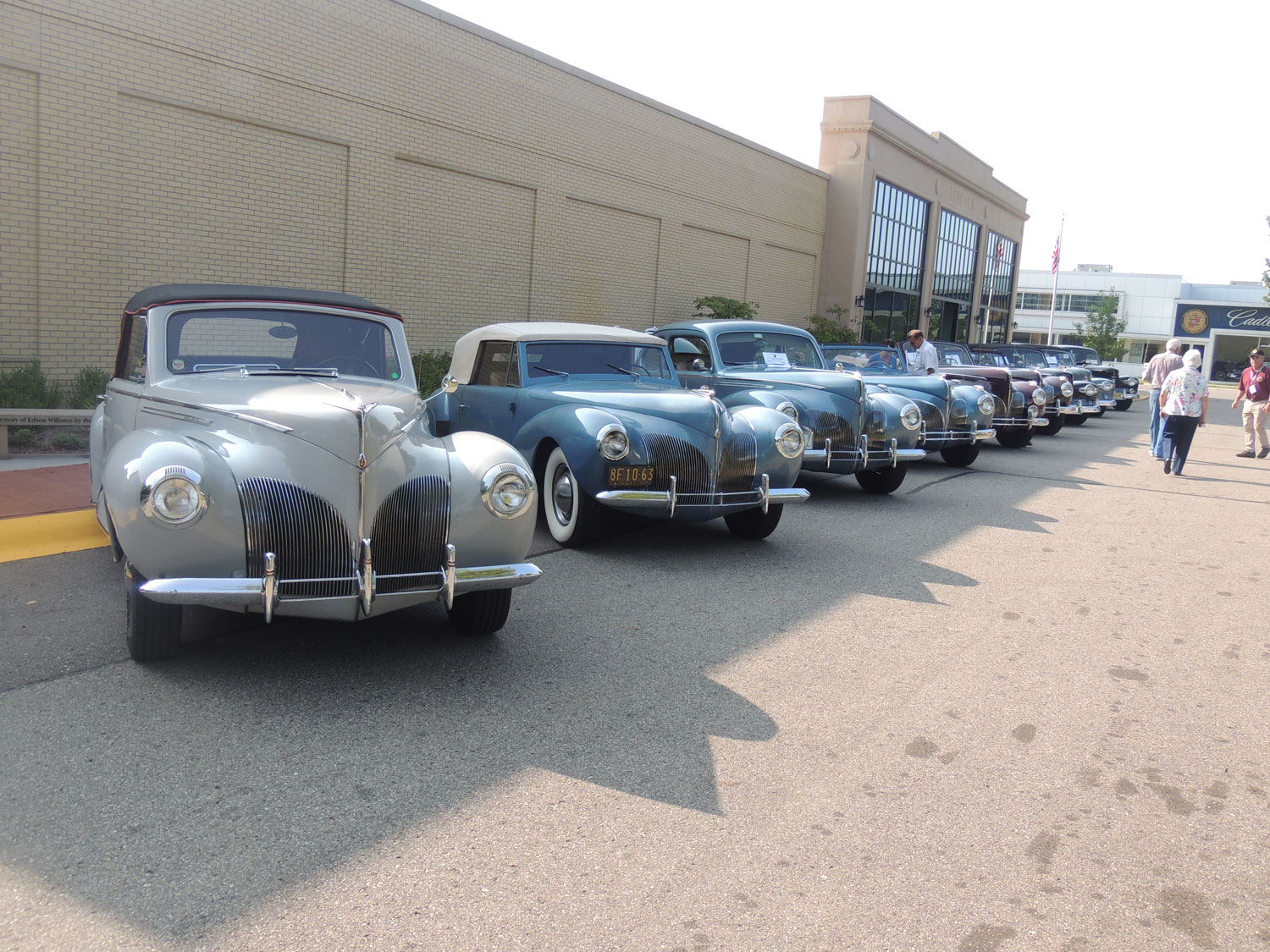 A row of Lincoln-Zephyrs in front of the Lincoln Motor Car Heritage Museum.